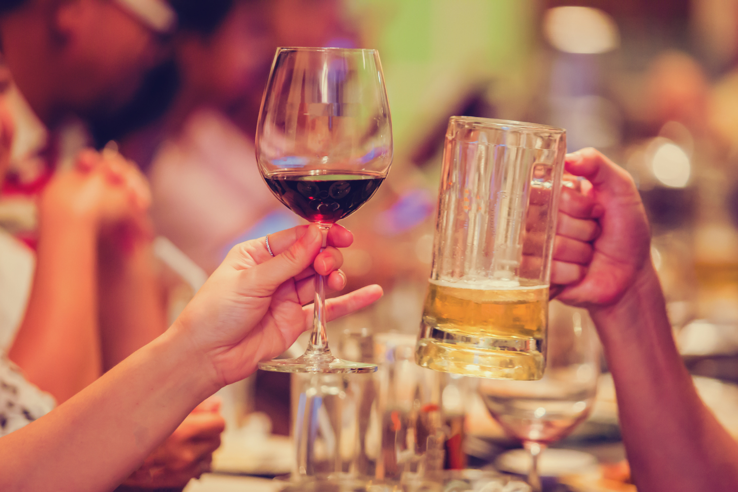 People with drinks making a toast.