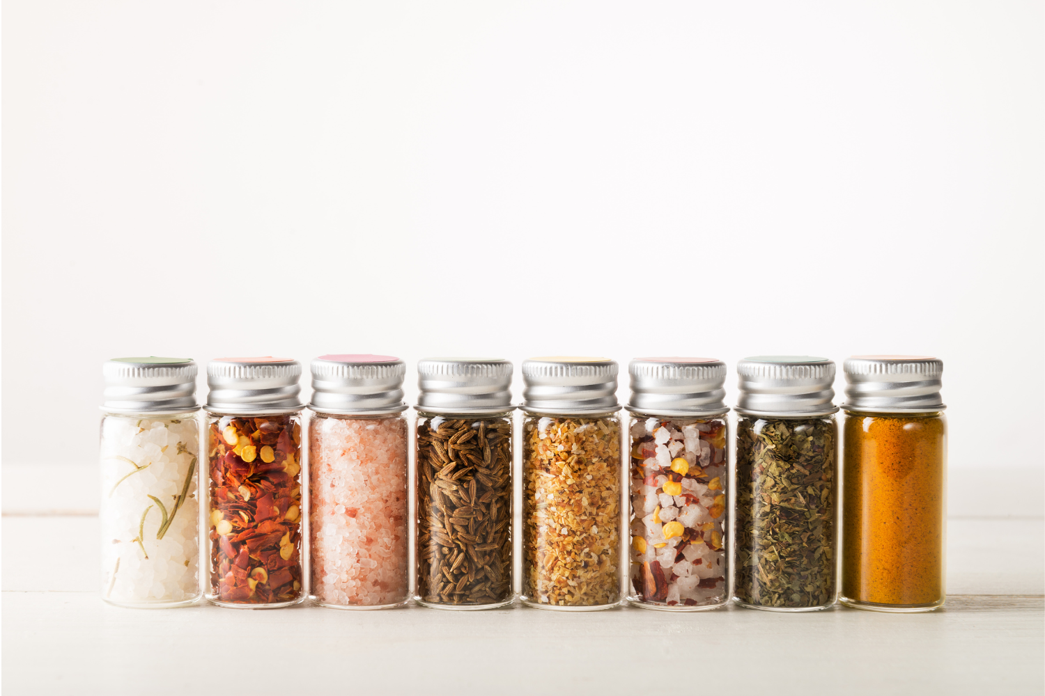 Herbs inside glass containers.