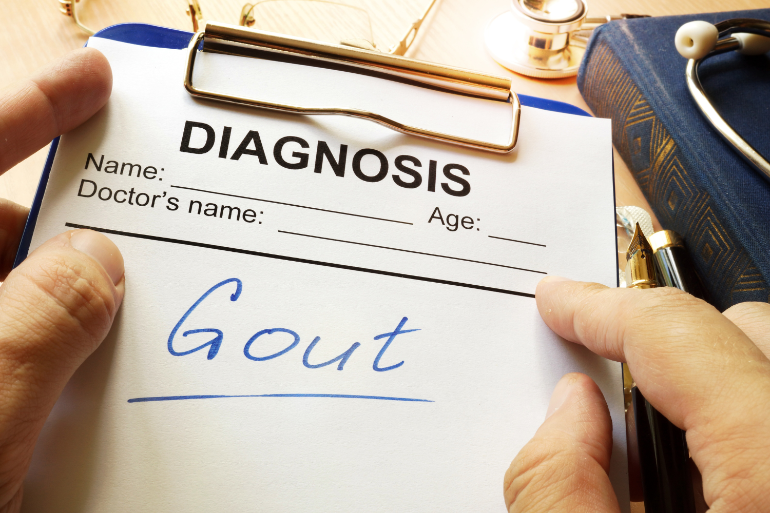 Medical diagnosis form with the word gout written on it, representing the stages of gout and uric acid buildup.