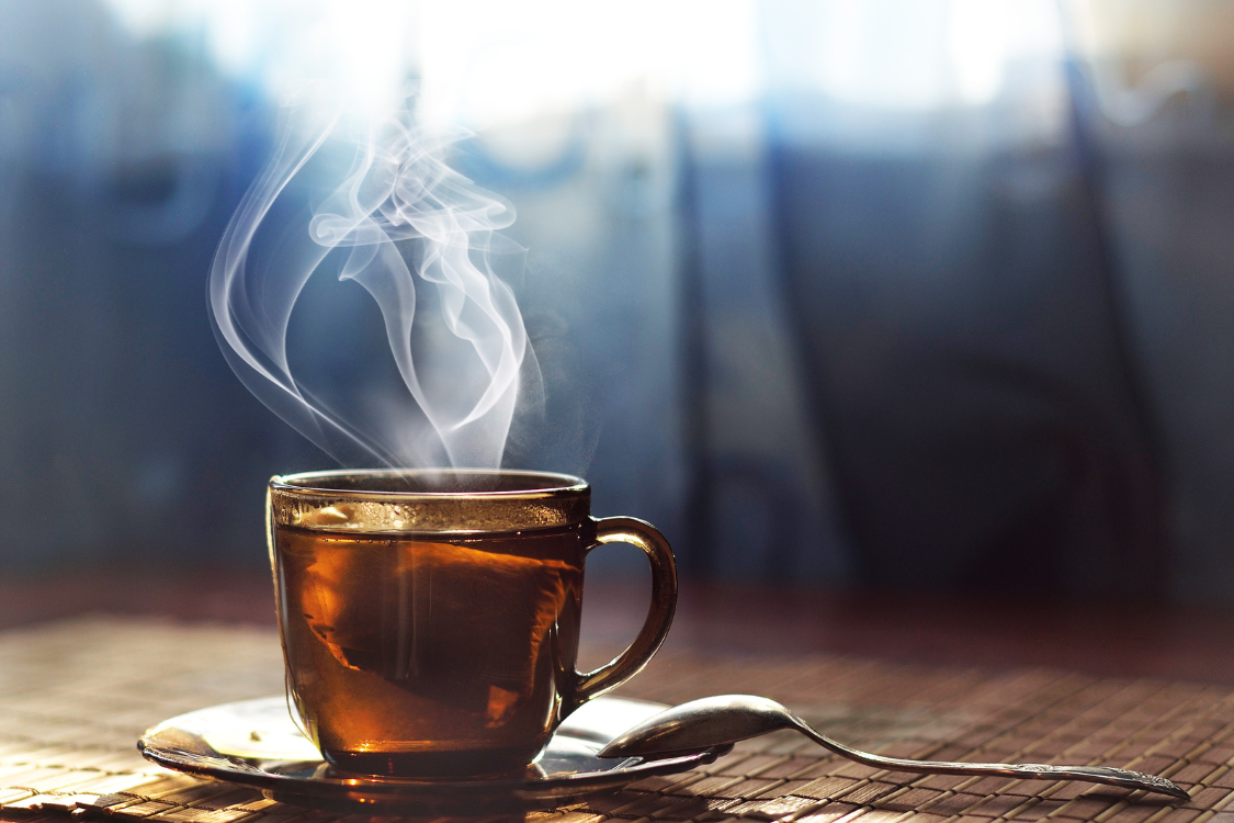 Steaming cup of herbal tea for kidney health support