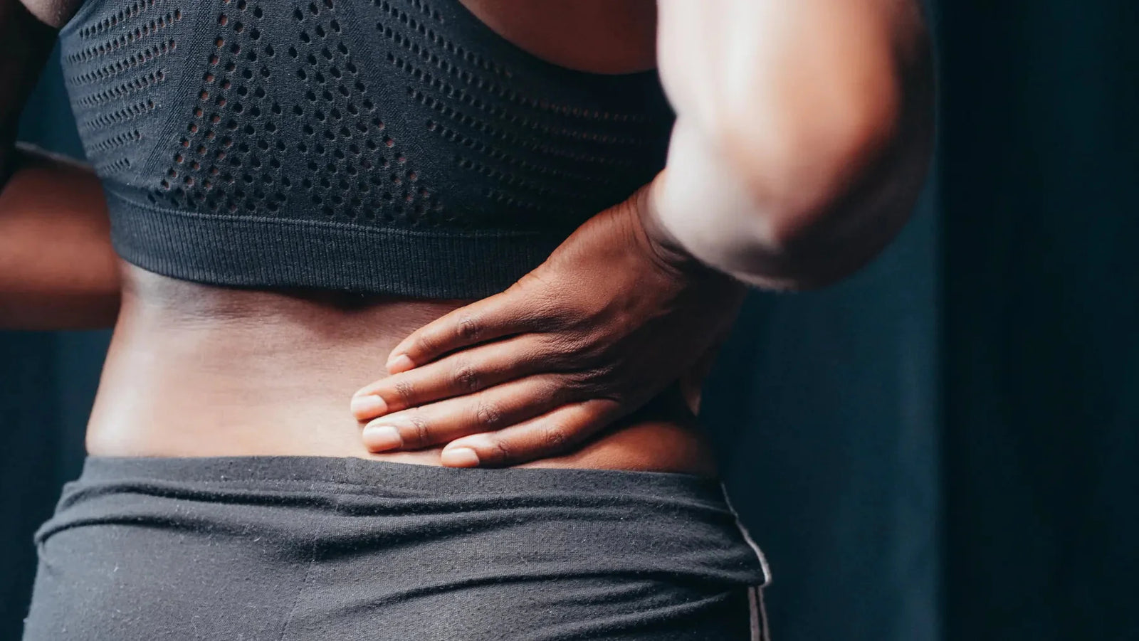 Woman with backache due to kidney disease.
