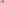         A person holding their foot with a red light on it.