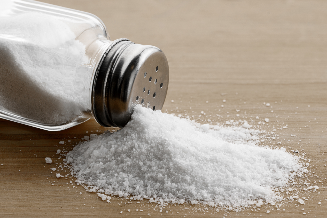 Salt spilling from salt shaker.