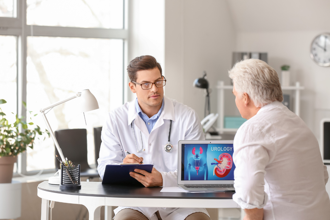 Urologist discussing prostate health and urology treatment with older man in clinic